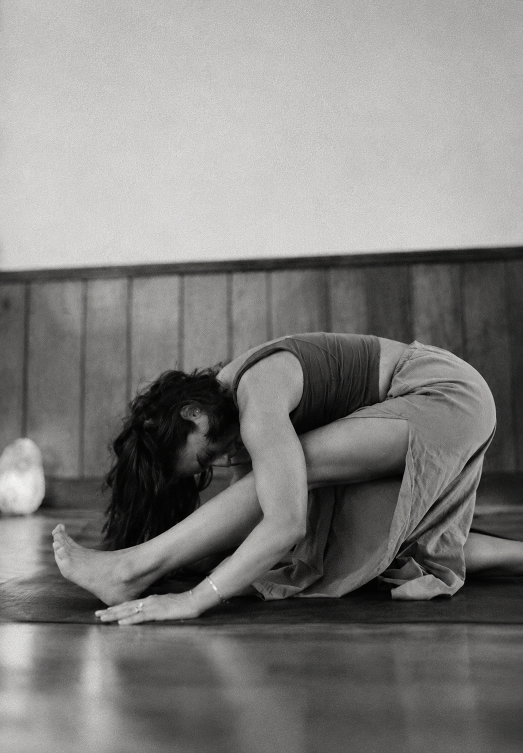 A yoga practitioner exploring a forward fold
